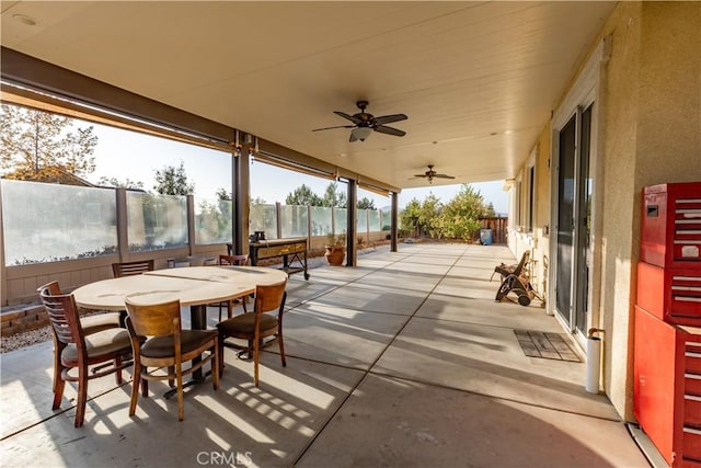 view of patio featuring ceiling fan