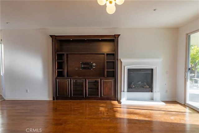 unfurnished living room featuring hardwood / wood-style floors