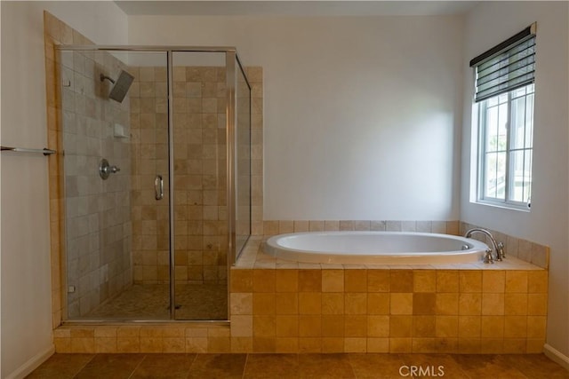 bathroom with plus walk in shower and tile patterned floors