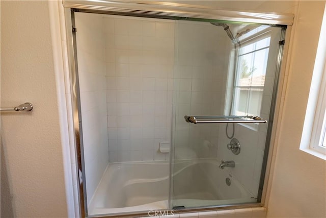 bathroom featuring enclosed tub / shower combo