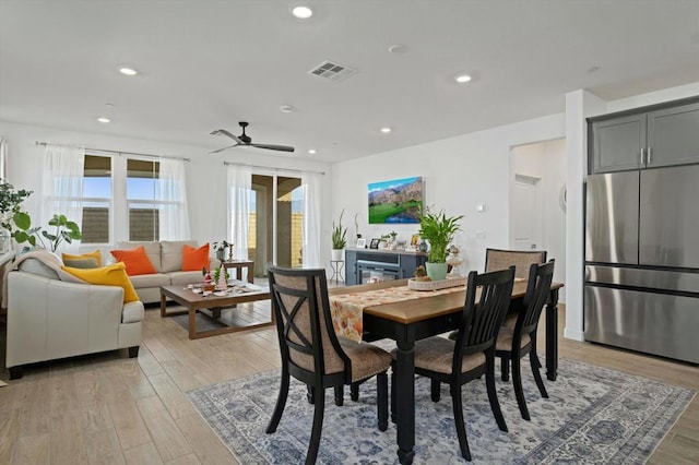 dining area featuring ceiling fan and light hardwood / wood-style floors