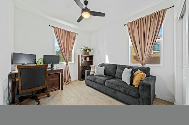 office featuring light hardwood / wood-style flooring and ceiling fan