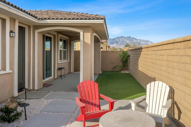 view of patio with a mountain view