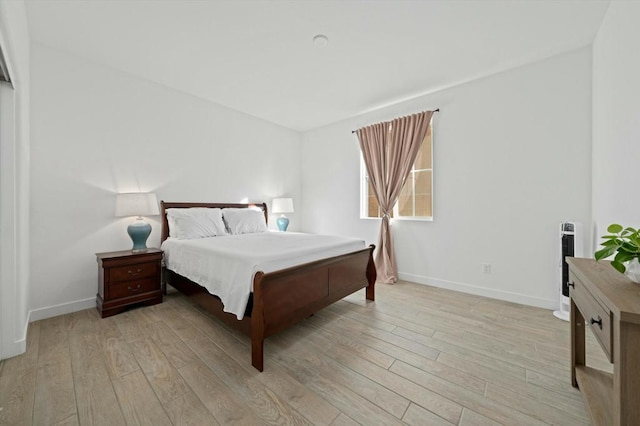 bedroom with light hardwood / wood-style flooring