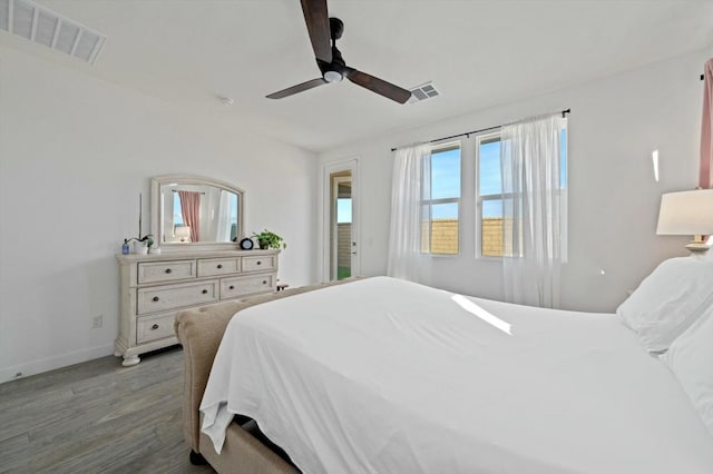 bedroom with ceiling fan and light hardwood / wood-style flooring