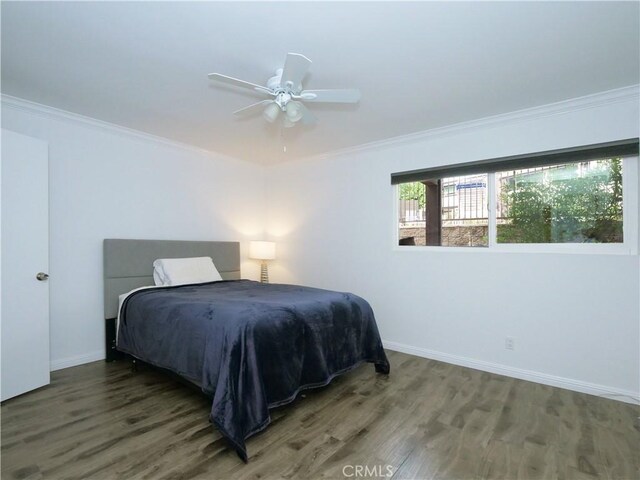 308 S Miraleste Dr Unit 57, San Pedro, CA 90732 - bedroom featuring ceiling fan, ornamental molding, and dark wood-type flooring