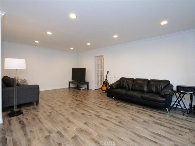 308 S Miraleste Dr Unit 57, San Pedro, CA 90732 - living room with light wood-type flooring and ornamental molding