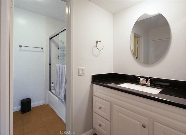 308 S Miraleste Dr Unit 57, San Pedro, CA 90732 - bathroom with tile patterned flooring, vanity, and enclosed tub / shower combo