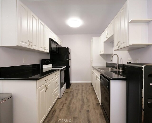 308 S Miraleste Dr Unit 57, San Pedro, CA 90732 - kitchen featuring black appliances, light hardwood / wood-style floors, white cabinetry, and sink