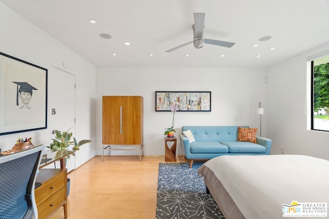 bedroom featuring ceiling fan and light hardwood / wood-style flooring