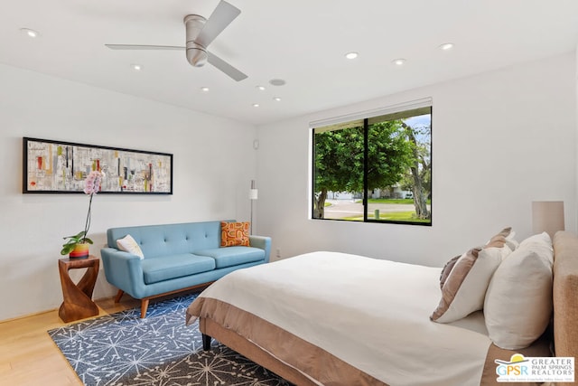 bedroom featuring hardwood / wood-style flooring and ceiling fan