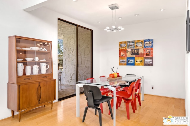 dining room featuring a notable chandelier and wood-type flooring