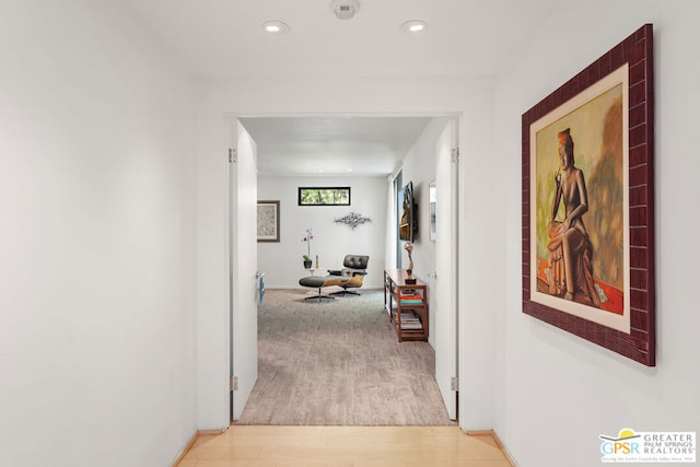 corridor with light hardwood / wood-style flooring