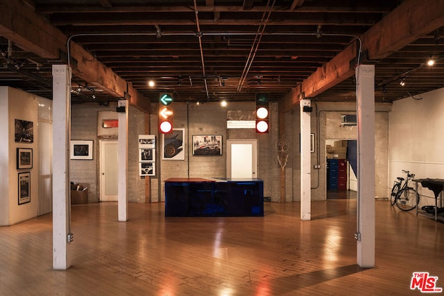 basement featuring hardwood / wood-style flooring