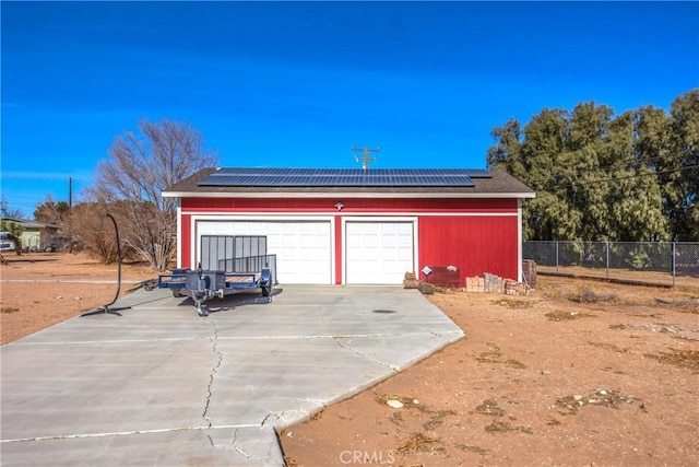 garage featuring solar panels