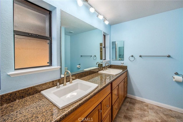 bathroom featuring vanity and tile patterned floors