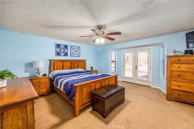 bedroom with french doors, light carpet, a textured ceiling, ceiling fan, and access to exterior