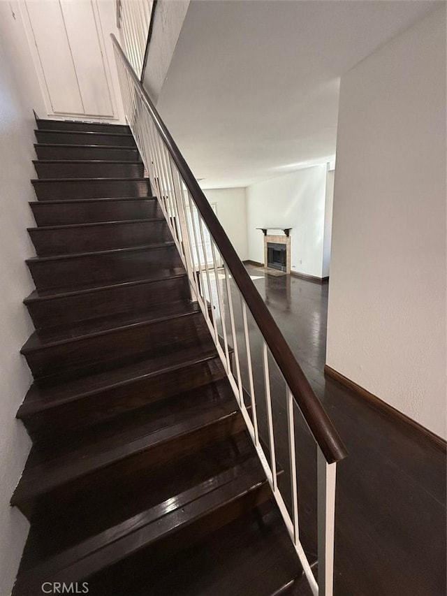 stairway featuring hardwood / wood-style flooring