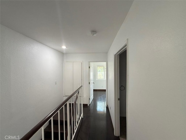 corridor featuring dark wood-type flooring