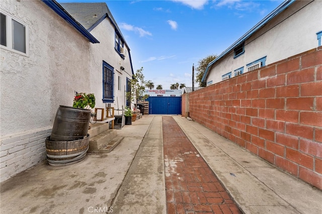 view of side of home with a patio