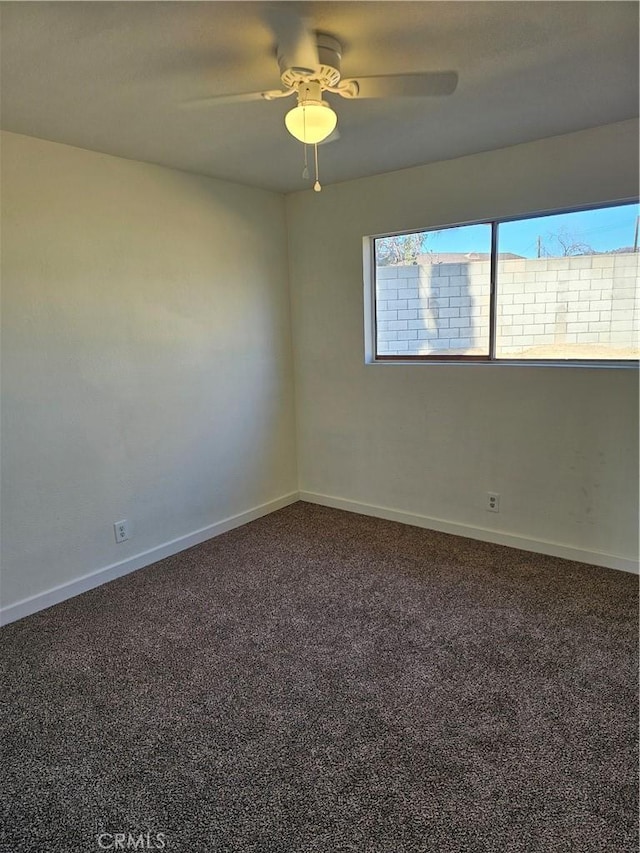 empty room with carpet floors and ceiling fan