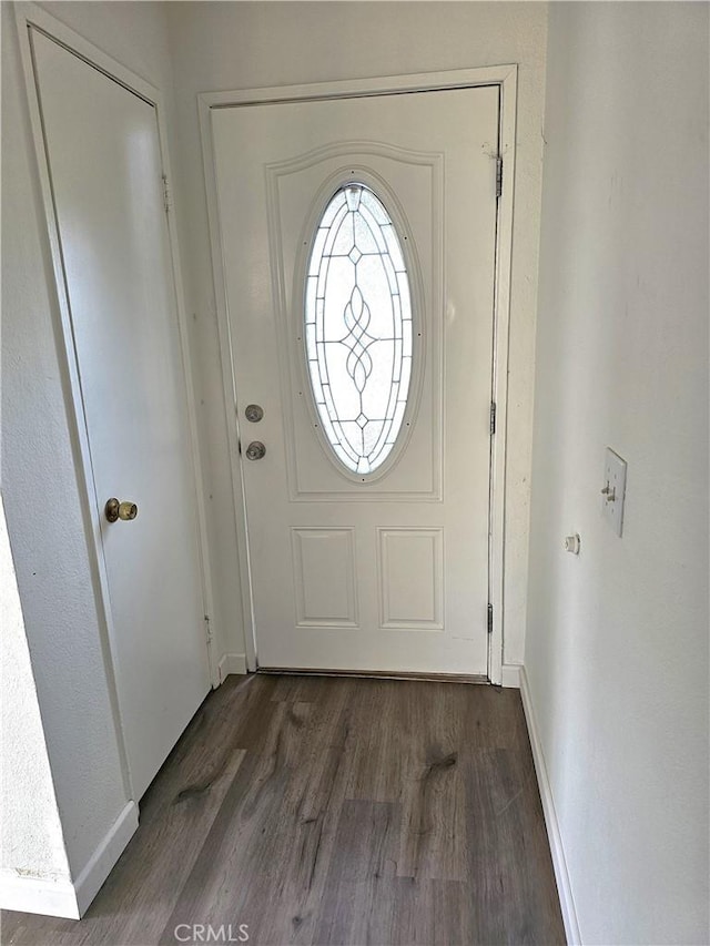 doorway to outside with dark hardwood / wood-style flooring