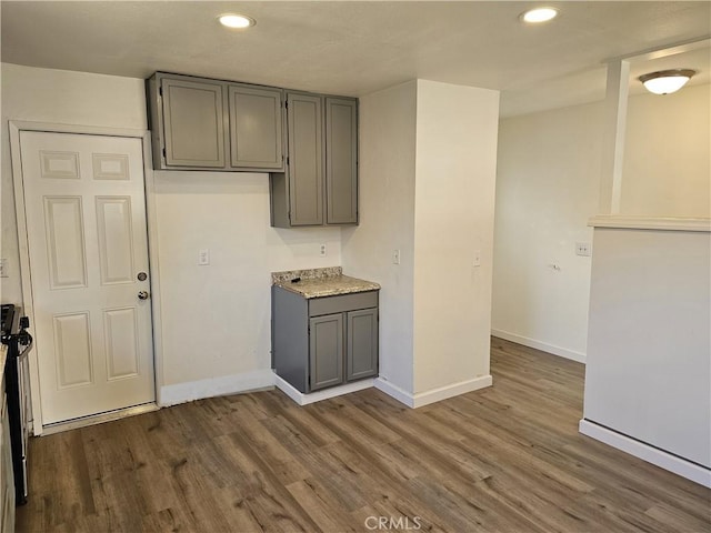 kitchen featuring dark wood-type flooring and gray cabinets