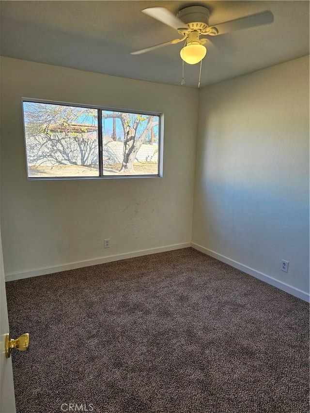 carpeted empty room featuring ceiling fan