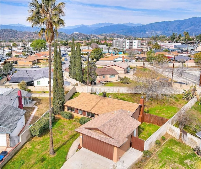 birds eye view of property featuring a mountain view and a residential view