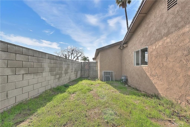 view of yard with a fenced backyard