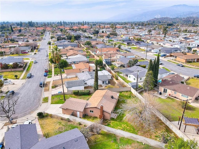 aerial view featuring a mountain view and a residential view