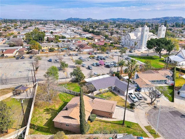 aerial view featuring a mountain view and a residential view