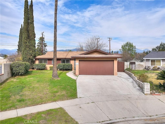 ranch-style home featuring a garage, concrete driveway, a front yard, and fence