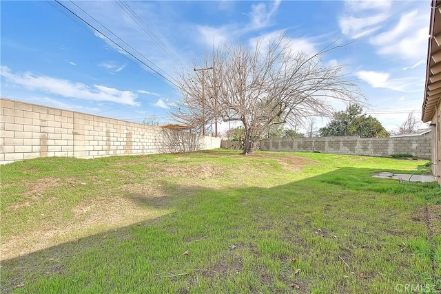 view of yard featuring a fenced backyard