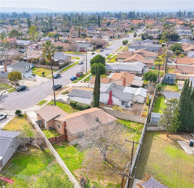 birds eye view of property with a residential view