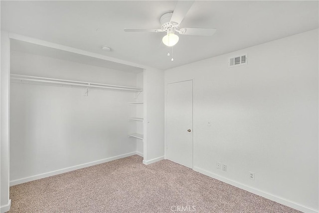 unfurnished bedroom with visible vents, baseboards, carpet, a closet, and a ceiling fan