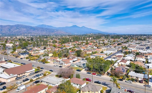 birds eye view of property featuring a mountain view and a residential view