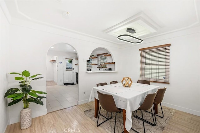 dining space with light hardwood / wood-style flooring