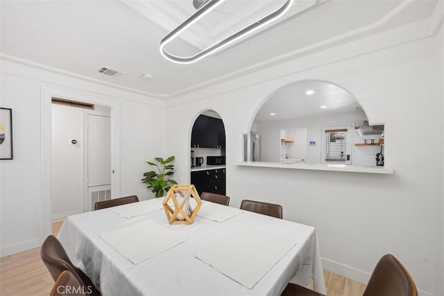 dining space featuring light hardwood / wood-style floors