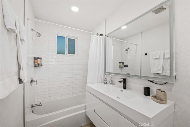 bathroom with vanity and shower / bath combination with curtain