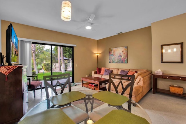 dining area featuring ceiling fan and light tile patterned floors