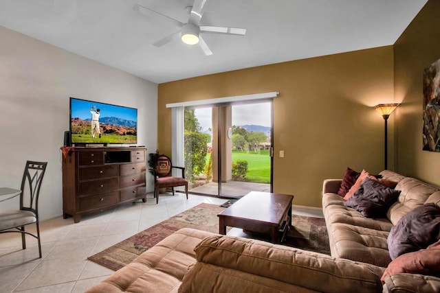 living room featuring ceiling fan and light tile patterned flooring