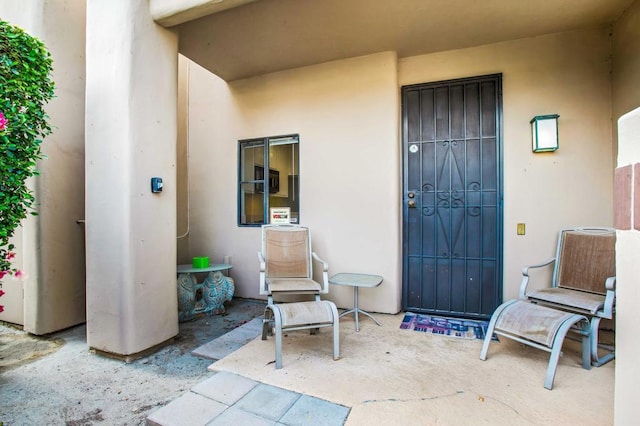 entrance to property with a patio area