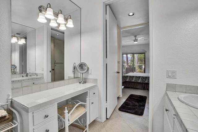 bathroom featuring tile patterned flooring, ceiling fan, and vanity