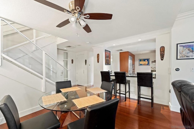 dining space with hardwood / wood-style floors