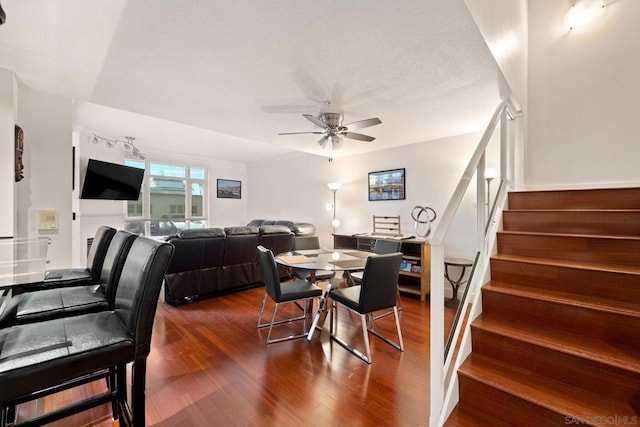 dining room with dark hardwood / wood-style floors and ceiling fan