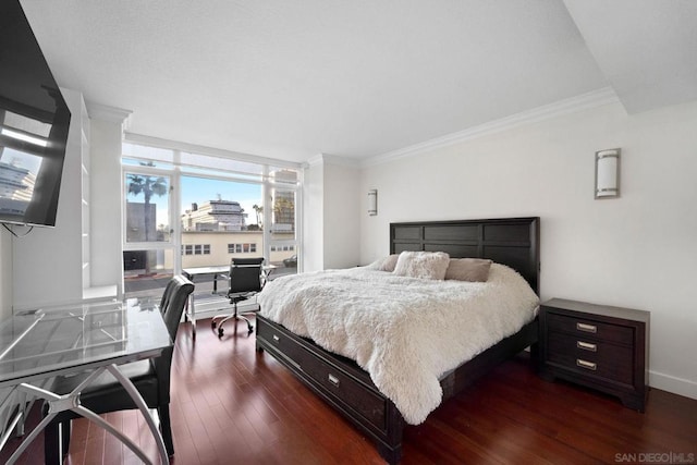 bedroom with dark wood-type flooring and ornamental molding