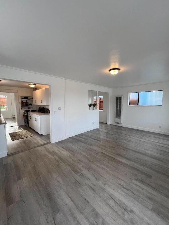 unfurnished living room featuring hardwood / wood-style flooring