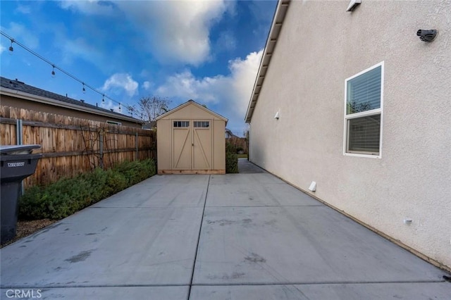 view of patio / terrace featuring a storage shed