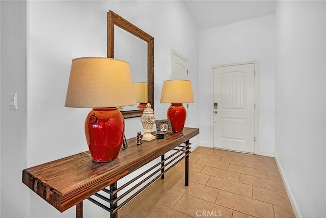 hall featuring light tile patterned floors